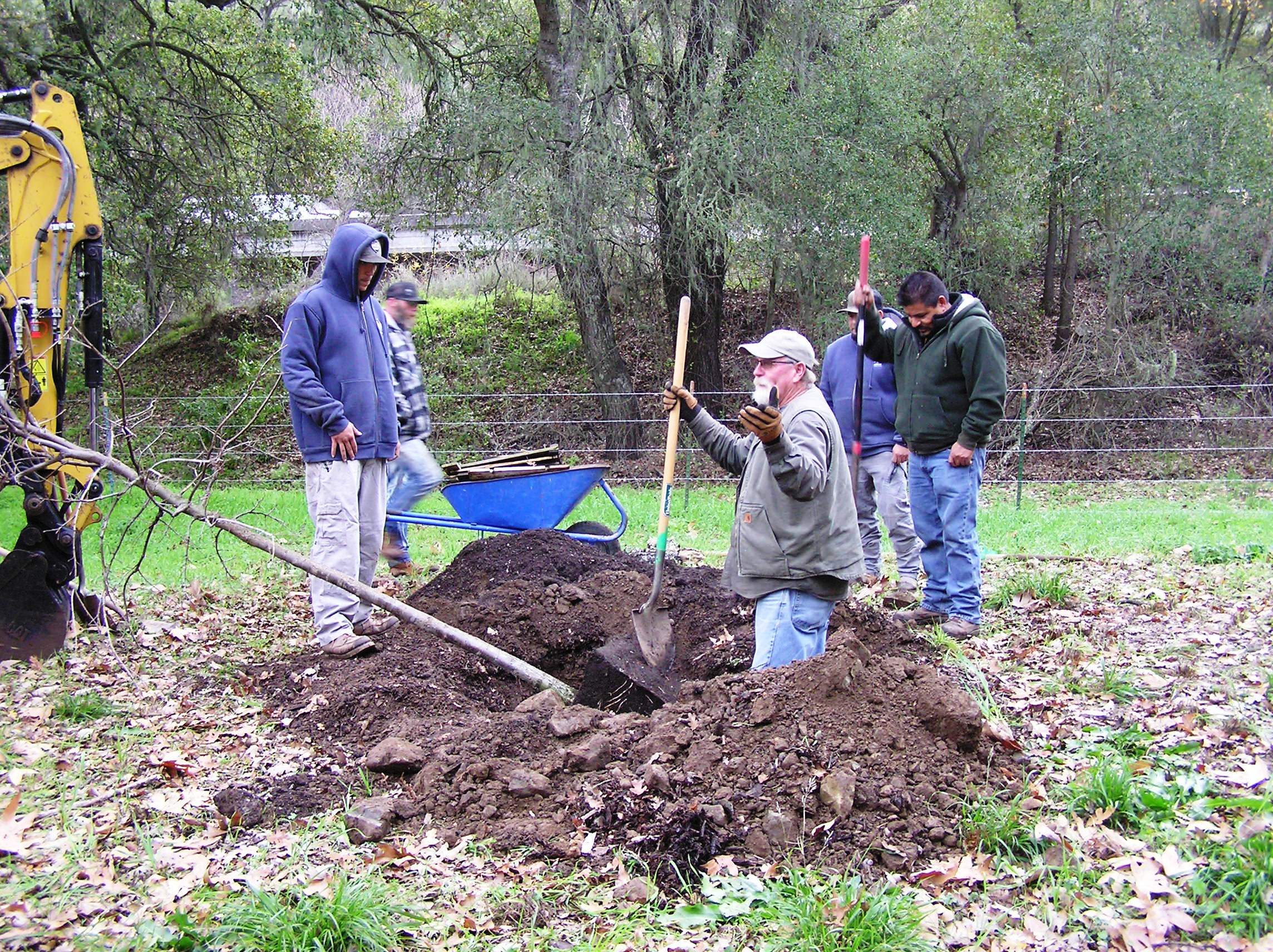 Cory Meyer providing detailed instruction on proper oak tree planting technique!
